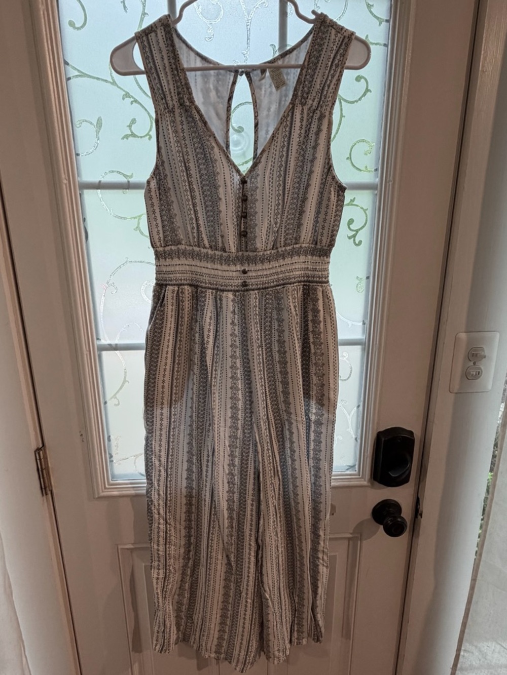 Sleeveless romper in blue and white